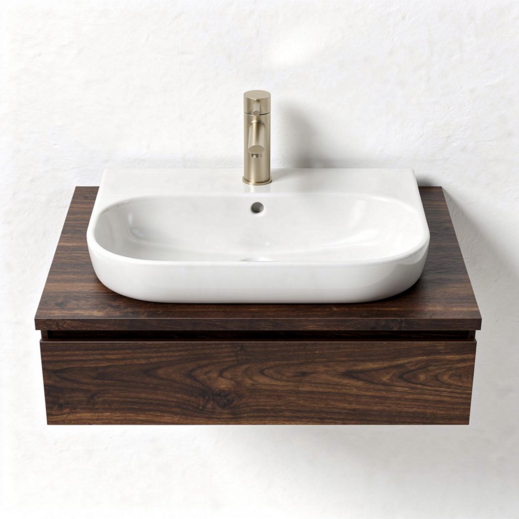 Wall-mounted bathroom sink with dark wood vanity and white ceramic basin
